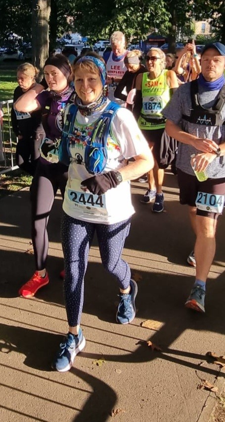 woman among half-marathon runners