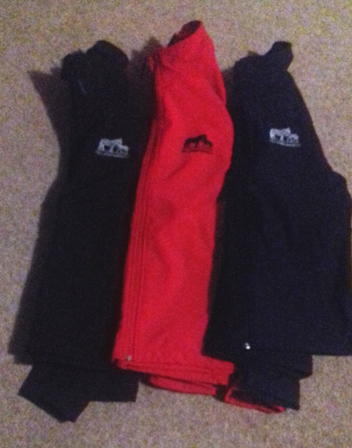 Black, red and navy soft shell jackets